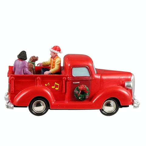 Promenade en camion rouge - Village Lemax